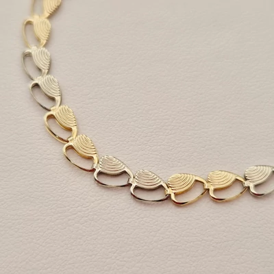 Sárga és fehér arany karkötő